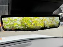 Digital rear view mirror that is zoomed in by default (see the picture below for the view without the camera turned on)