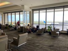 The decor is indeed stuck in a timewarp, but windows make the space light... it reminds me a but if the old Global First UA F lounge in SFO.