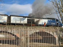 Lead power car on fire adjacent to what used to be Dundee Esplanade station. 