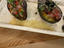 smoked avocado stuffed with roasted peppers and marinated salmon