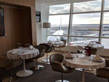 The dining side of the JFK private lounge, and stunning tarmac views!