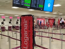 Loganair check-in area in Edinburgh airport (EDI): Loganair is one of the few airlines whose logo has not changed since the early years, when I was little 