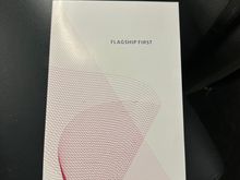 The inconsistent branding continues. The flight is marketed as flagship business and books into J etc., however The boarding pass and menu say first. No wonder the QF F lounge is annoyed with AA tcon passengers 