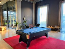 There is a pool table, some small meeting rooms in the background. It was actually used by guests last night.