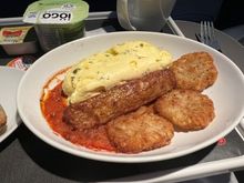 Parsley omelette, chicken sausage, breakfast potatoes, and vegetable salsa.