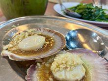 Today we ordered scallops with garlic, veg, and a fresh coconut to drink…