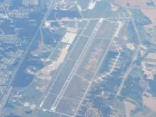 Saw this nice airport from the air and took a photo. No clue where it is! Anyone??
