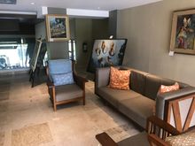Floor Overlooking Reception with Lots of Artwork 1