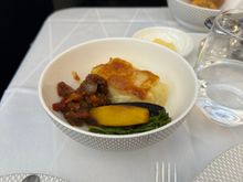 Side dish: potato, carrots, broccolini, and peppers.