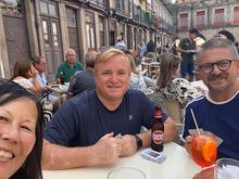 Playing cards, listening to the LOUD church bells, and watching a parade. All while drinking Aperol Spritz! 