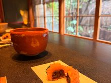 Tea house. Hot matcha drink and red bean sweet.