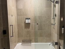 Shower that had mediocre water pressure, but also managed to spray water everywhere