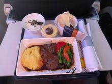 CFU/LHR  today. No menus. Beef Cheeks for him. His starter was a rather nice coleslaw type effort which I ate. He liked the main - very tasty he said. Then it was Cherry trifle, which I also had and that was nice. 