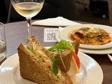 BA lounge at CPT. Exceeded my expectation. Sandwich, nachos and nice wine delivered to table.