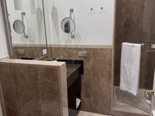 The bathroom is away from.the bedroom which is good in the night to not disturb so,eine sleeping with turning on the lights. Water pressure was fine. Toiletries are all from L’Occitaine. 
