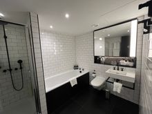Deluxe King bathroom; full-sized tub, stall shower which was a tad small. Good water pressure.