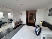 Bedroom has no TV, thus suggesting a multitude of sins, nothing is more of a buzzkill and partypooper than that the TV shows talkshows