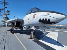 This is an F-14. The Hornet hanger has a wall mural showing all the planes that flew off the carrier up to its retirement in 1970. While the F-14 never flew from this ship I bet it attracts a lot of visitors.