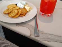 Pre-pre-flight cheese and a Campari & soda in a lounge