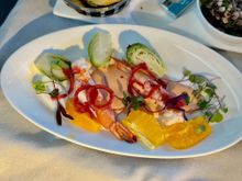 Poached jumbo prawns, brussel sprouts, orange segments, pearl onion confit, cocktail sauce