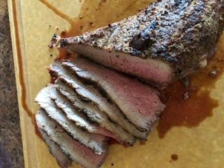 This Tri-tip steak was dinner tonight. I left the cutting board too close to the edge of the counter and while we were eating, a certain puppy named Poppy did some counter surfing and took the unsliced portion.  Then she took it and jumped up on the couch in the family room and got comfortable on a couple of nice Crate and Barrel pillows and chowed down, getting grease all over them and the bottom cushion.  She is really lucky she’s so cute. :mad: