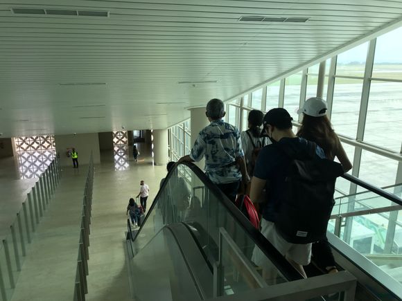 When to board the aircraft, you'll go 1 level down by elevator  or escalator