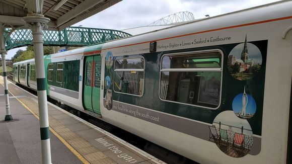Local train at Falmer Station, with the Amex's arches looming.