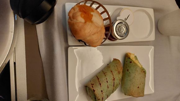 My wife's VLML breakfast. The wrap might have been the same as the onboard veggie main of scranbles egg wrap with green peppers.  The wrap was warm/ toasted.

