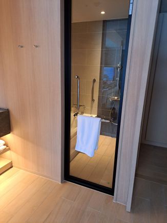 The bathroom and the wetroom with separate bath and shower ( no rainhead  shower). The toilet is in a separate room across the hall