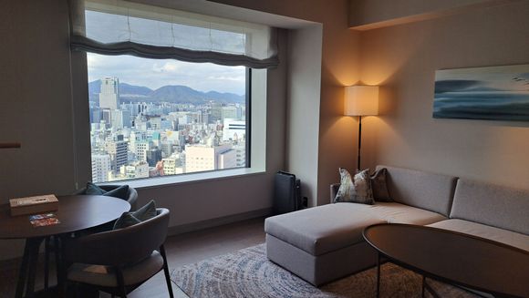Living room. Tv to left and coffee/tea facilities and entrance hall to right