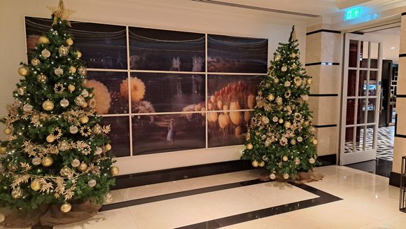 Christmas trees by entrance to the breakfast restaurant at Conrad