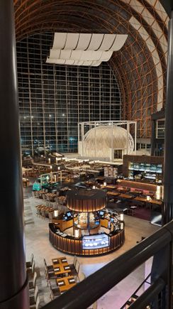 View of the atrium and breakfast area from 5th floor walkway ( gym and pool access close by on 5th floor) at night