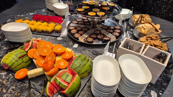 Fruit, fruit cakes, cheese and crackers 