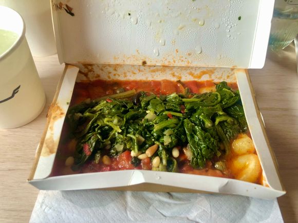 Lunch, gnocchi with spinach and tomato sauce 