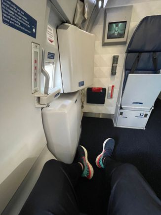 22A viewpoint of 5’10” male. Note the window (not in picture) is on your left at shoulder, so if you like staring out it, you’ll have to twist your neck quite a bit…

The aisle seats get to play footsie with the flight attendant sat directly across during takeoff/landing