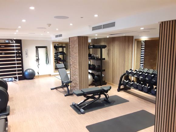 Ample free weights, kettlebells, balls, bands, and mats.  One foam roller.  Two large areas where you can workout in front of mirrors.  One accommodates two people easily. Notice the programmable multi-purpose weight machine in far wall.