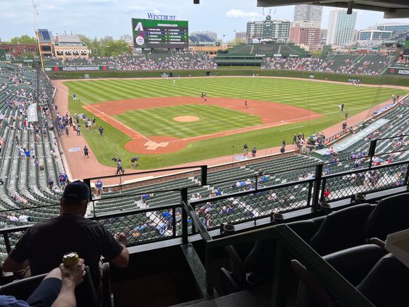 There are twelve outdoor seats. Four of them are high bar stools at a small table. 