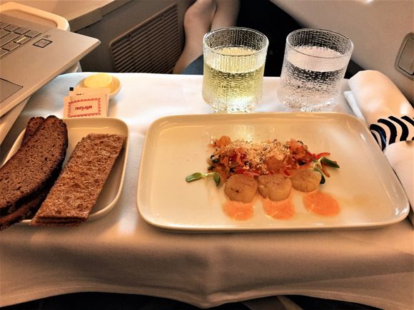Scallops with pomelo salad. I heard fellow passenger few rows behind me being extremely upset about the small portion...?!