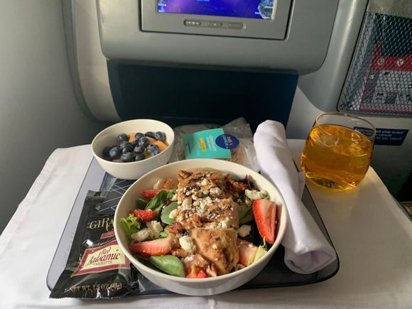 Pre-arrival meal choice of cold chicken salad or fruit and cheese plate