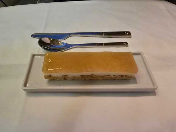 Crunchy biscuit, almound mousse and pear confit dessert