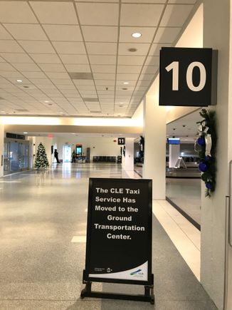Sign directing passengers to new taxi stand.
