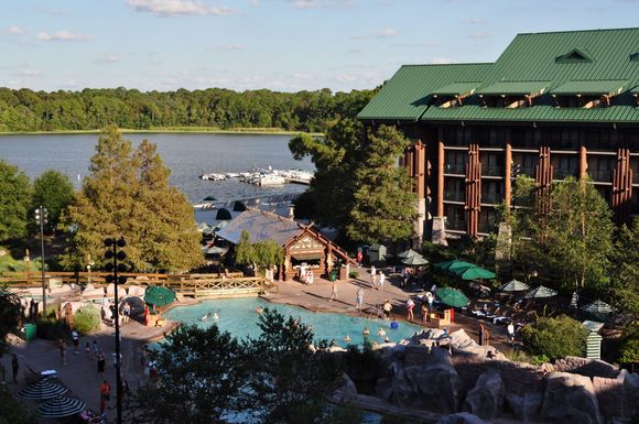Waterslide is ar the bottom right of screen, pool bar in the  middle, the gyeser is out of sight to the left and the other pool is on the other side of the building
