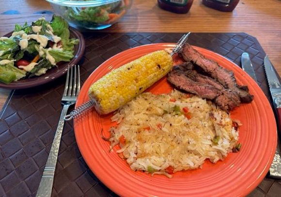 with Costco’s reconstituted hash browns grilled in foil with onions, peppers, butter and salt and pepper and corn. 