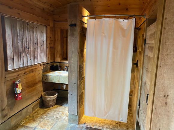 Shower and sink area within men’s side of o den.