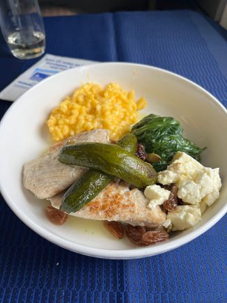 The chicken dish. Tray, weird “salad”, and utensils served separately 