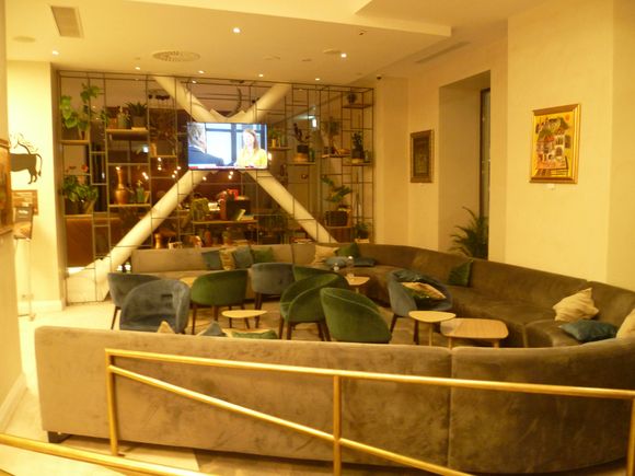 Foyer seating on right of entrance, beside restaurant