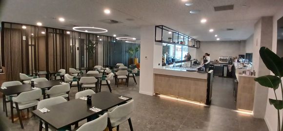 Bar area access from front foyer, leading into the dining area.