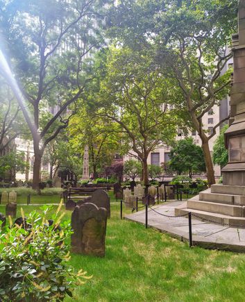 Tombstones in the peace and quiet of the grounds surrounding the Trinity Church, just steps away from the 9/11 Memorial 