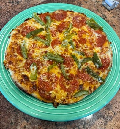 I came across a recipe for “skillet pizza,” made stove top in a caste iron skillet. I “cheated” slightly by putting it under the broiler for about a minute to brown the cheese. Looks prettier than it tasted, but not bad. 