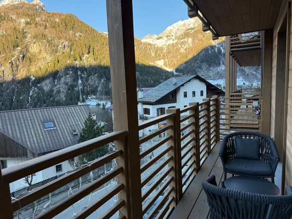 The balcony is large with seating for two. It is not visually private, since your neighbors can see you.